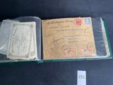 an old envelope with stamps on it sitting on a table