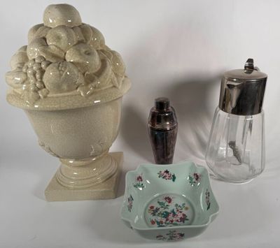 a vase, salt and pepper shaker on a table