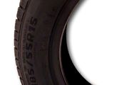 a tire that is sitting on a white surface