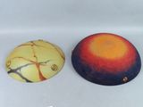 two decorative items that are sitting on a table
