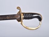 a close up of a sword on a white background