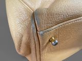 an image of a close up of a purse on a table