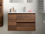 a bathroom with a sink, mirror, and cabinet in it
