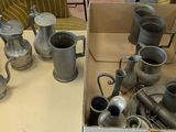 a box full of silver items on a table