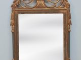 an image of a mirror sitting on top of a wooden floor