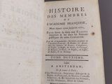 an open book with a black and white image of a man ' s face