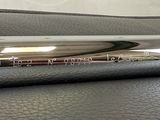 an image of a close up of a pen on a leather surface