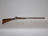 a gun that is sitting on top of a table