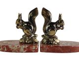 pair of brass squirrel bookends on red marble base