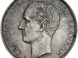 gros plan d'une pièce de monnaie sur laquelle figure un visage de femme
