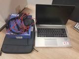 a laptop and headphones sitting on a desk next to a laptop