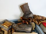 a pile of shoes that are sitting on top of a box
