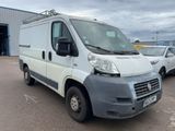 a picture of a white van parked in a parking lot