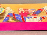 a pink box with toothbrushes and toothpaste in it