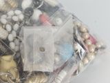 a bag of assorted beads and other items in it