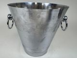 a large metal vase with two handles on it