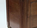 a small wooden table with a marble top on it
