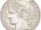 a close up of a coin with a woman ' s head on it
