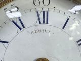a close up of a clock with roman numerals on it