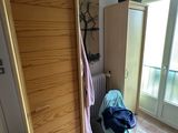 a room with a closet and a chair in it
