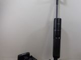 two vacuums that are on the floor next to each other