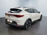 the rear end of a white suv parked in a room