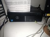 a dell desktop computer sitting on a desk next to a keyboard