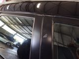 a reflection of a car in the rear window of a vehicle