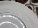a white plate with a black and white design on it