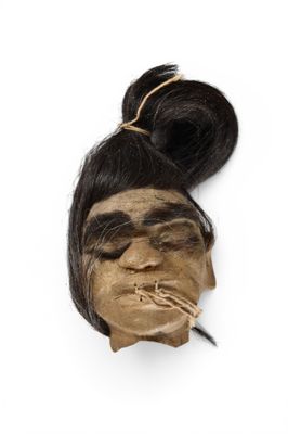 head of a woman with a cigarette in her mouth