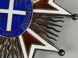 an image of a blue and white star with a cross on it