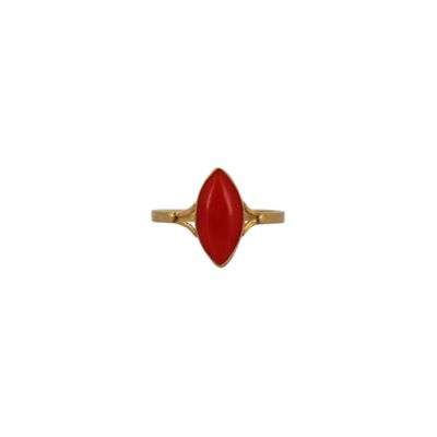 a gold ring with a red stone in the middle