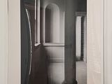 a black and white photo of a hallway in a house