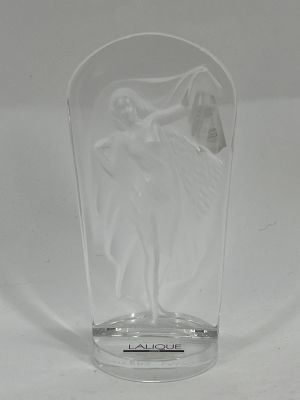 a clear glass vase with a statue of a woman on it