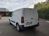 a white van that is parked in a parking lot