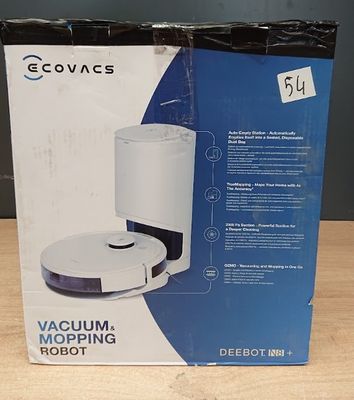 La boîte du robot aspirateur-laveur est ouverte sur la table.