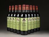 six bottles of red wine are lined up in a row
