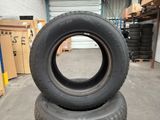 two tires stacked on top of each other in a warehouse