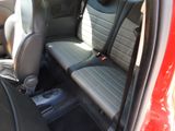 two seats in the back of a red car