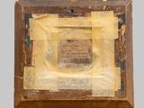 an old wooden frame with a picture of a man on it