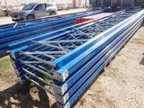 a lot of blue steel beams sitting on the ground