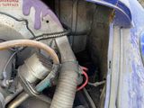 a close up of a car ' s engine with the hood open