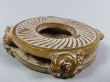 a picture of a gold colored object with a lion on it