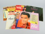 a lot of elvis presley records on the table