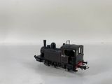 a toy train on a white surface with a white background