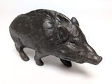 a small statue of a boar on a white surface