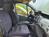 a yellow car with two seats in the back of it