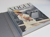 a book with a picture of a woman sitting on a bench