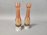 two vases that are sitting on a table