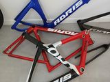 three bikes are lined up on the floor next to each other